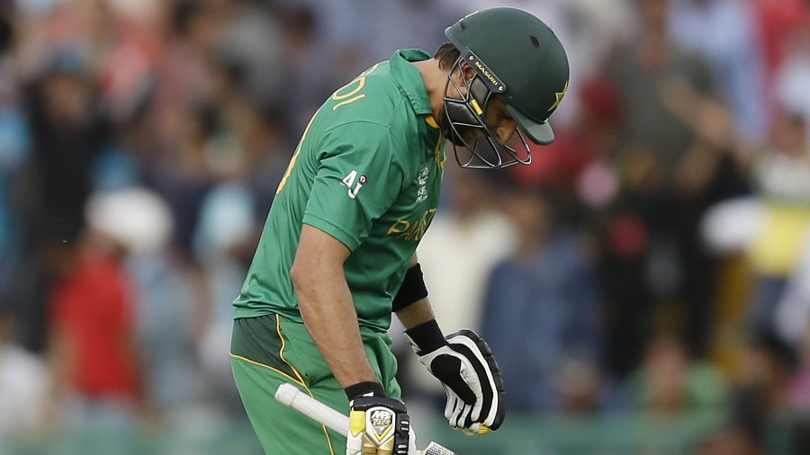 Pakistan's Shahid Afridi walks from the field after he was dismissed for 14 runs during their ICC World Twenty20 2016 cricket match  against Australia in Mohali, India, Friday, March 25, 2016. (AP Photo/Altaf Qadri)