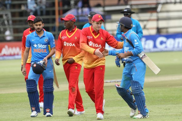 Zimbabwe and Indian cricket players shake hands at the end of the One Day International cricket match between the two teams at Harare Sports Club, Monday, June, 13, 2016. The Indian crcket team is in Zimbabwe for One Day International and T20 matches.(AP Photo/Tsvangirayi Mukwazhi)