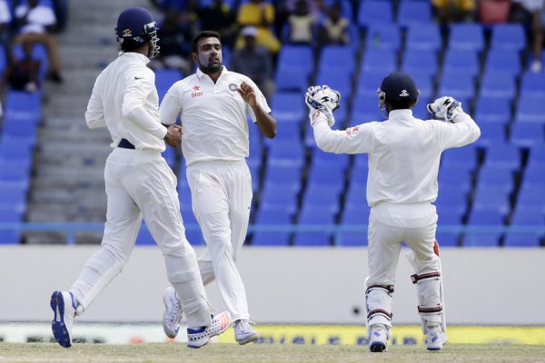 India's bowler Ravichandran Ashwin center celebrates with teammates after he bowled out West Indies' Marlon Samuels during day four of their first cricket Test match at the Sir Vivian Richards Stadium in North Sound, Antigua, Sunday, July 24, 2016. (AP Photo/Ricardo Mazalan)