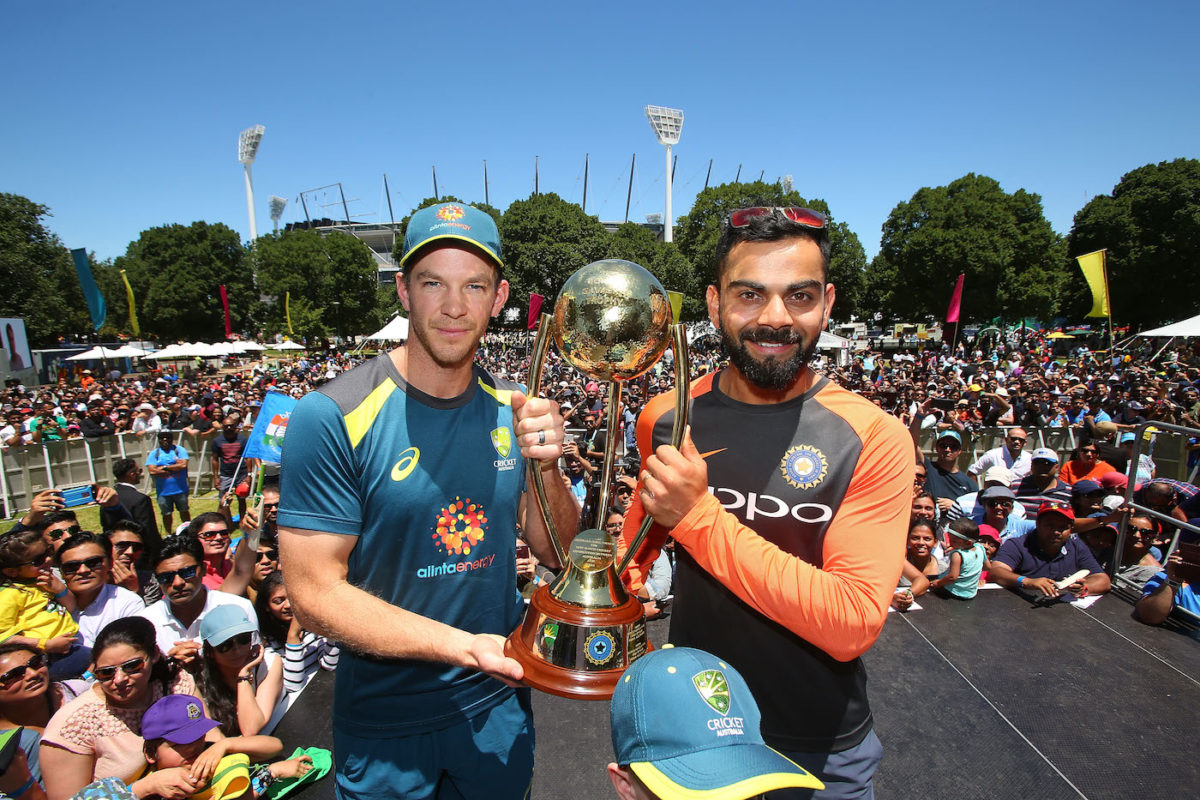 Virat Kohli of India and Tim Paine of Australia pose with the BorderÐGavaskar Trophy ahead of the Boxing Day Test during the Indian Summer Festival Family Day at the Melbourne Cricket Ground on December 23, 2018 in Melbourne, Australia.