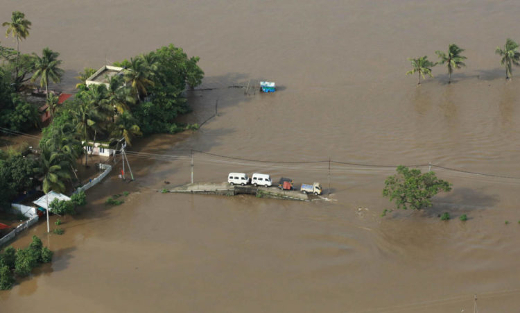 TOPSHOT - View of a flooded area is pictured in the north part of Kochi, in the Indian state of Kerala on August 18, 2018. - Rescuers in helicopters and boats fought through renewed torrential rain on August 18 to reach stranded villages in India's Kerala state as the toll from the worst monsoon floods in a century rose above 320 dead. (Photo by - / AFP)        (Photo credit should read -/AFP/Getty Images)