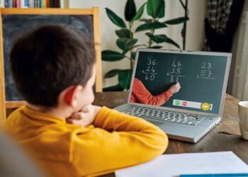 6-7 years cute child learning mathematics from computer.
