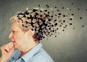 Memory loss due to dementia. Senior woman losing parts of head feeling confused as symbol of decreased mind function.