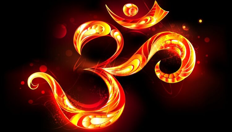 Patterned ohm symbol from bright flame on black background.