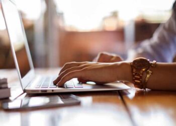 Female student checking her computer