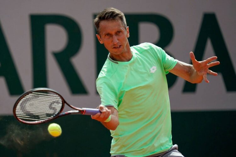 Ukraine's Sergiy Stakhovsky returns the ball to France's Gilles Simon during their men's singles first round match on day two of The Roland Garros 2019 French Open tennis tournament in Paris on May 27, 2019. (Photo by Kenzo TRIBOUILLARD / AFP) (Photo by KENZO TRIBOUILLARD/AFP via Getty Images)