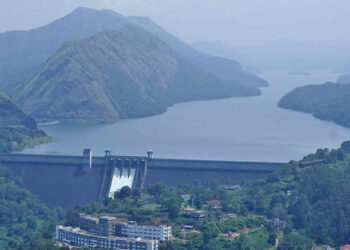 A general view shows the Cheruthoni Dam with its shutters open after water levels reached a height 2395 ft. following torrential rains in south India state of Kerala, in Idukki on October 19, 2021. Photo: Appu S Narayanan/AFP