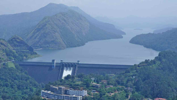 A general view shows the Cheruthoni Dam with its shutters open after water levels reached a height 2395 ft. following torrential rains in south India state of Kerala, in Idukki on October 19, 2021. Photo: Appu S Narayanan/AFP