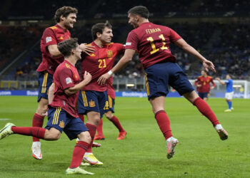 Spain's Ferran Torres, right, celebrates with teammates after scoring during the UEFA Nations League semifinal soccer match between Italy and Spain at the San Siro stadium, in Milan, Italy, Wednesday, Oct. 6, 2021. (AP Photo/Antonio Calanni)