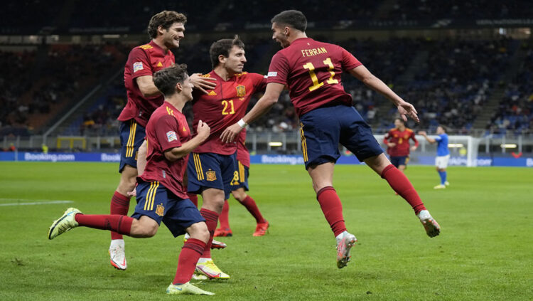 Spain's Ferran Torres, right, celebrates with teammates after scoring during the UEFA Nations League semifinal soccer match between Italy and Spain at the San Siro stadium, in Milan, Italy, Wednesday, Oct. 6, 2021. (AP Photo/Antonio Calanni)