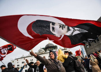 A Turkish woman waves a Turkish national flag with a portrait of Turkey's modern founder Mustafa Kemal Ataturk in front of Yeni Camii on April 12, 2017  during a campaign rally for the "yes" vote in the upcoming constitutional referendum in Istanbul's Eminonu district. 
The Turkish public will vote on April 16, 2017 on whether to change the current parliamentary system into an executive presidency.  / AFP PHOTO / BULENT KILICBULENT KILIC/AFP/Getty Images