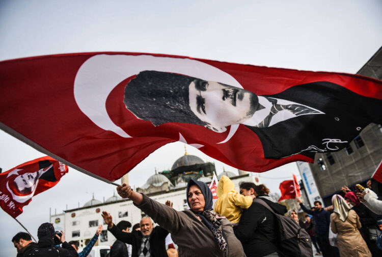 A Turkish woman waves a Turkish national flag with a portrait of Turkey's modern founder Mustafa Kemal Ataturk in front of Yeni Camii on April 12, 2017  during a campaign rally for the "yes" vote in the upcoming constitutional referendum in Istanbul's Eminonu district. 
The Turkish public will vote on April 16, 2017 on whether to change the current parliamentary system into an executive presidency.  / AFP PHOTO / BULENT KILICBULENT KILIC/AFP/Getty Images