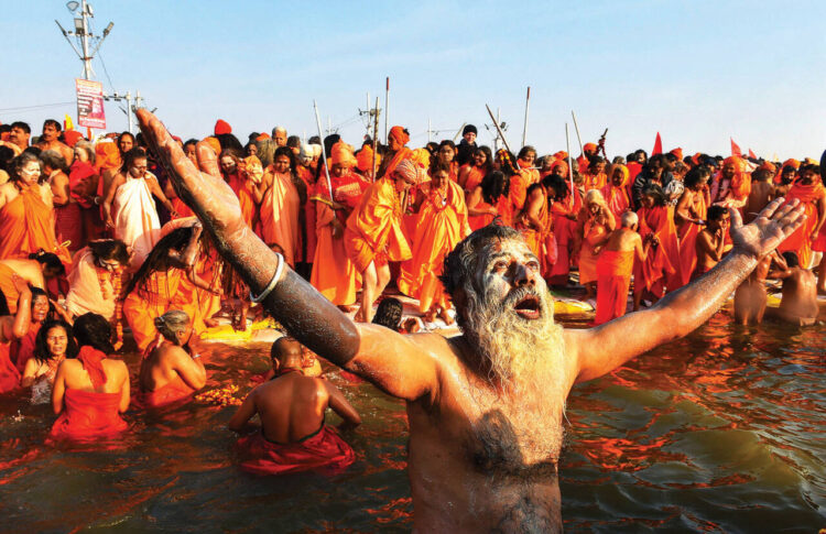 Allahabad: Juna Sadhus take a holy dip at Sangam during Makar Sankranti, on the first day of the Kumbh Mela, or pitcher festival in Allahabad (Prayagraj), Uttar Pradesh, Tuesday, Jan.15, 2019. (PTI Photo/Shahbaz Khan)(PTI1_15_2019_000058B)