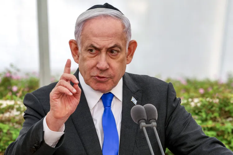 Israeli Prime Minister Benjamin Netanyahu speaks during a state memorial ceremony for the victims of the 1948 Altalena affair, at Nachalat Yitzhak cemetery in Tel Aviv on June 18, 2024. (Photo by Shaul GOLAN / POOL / AFP)